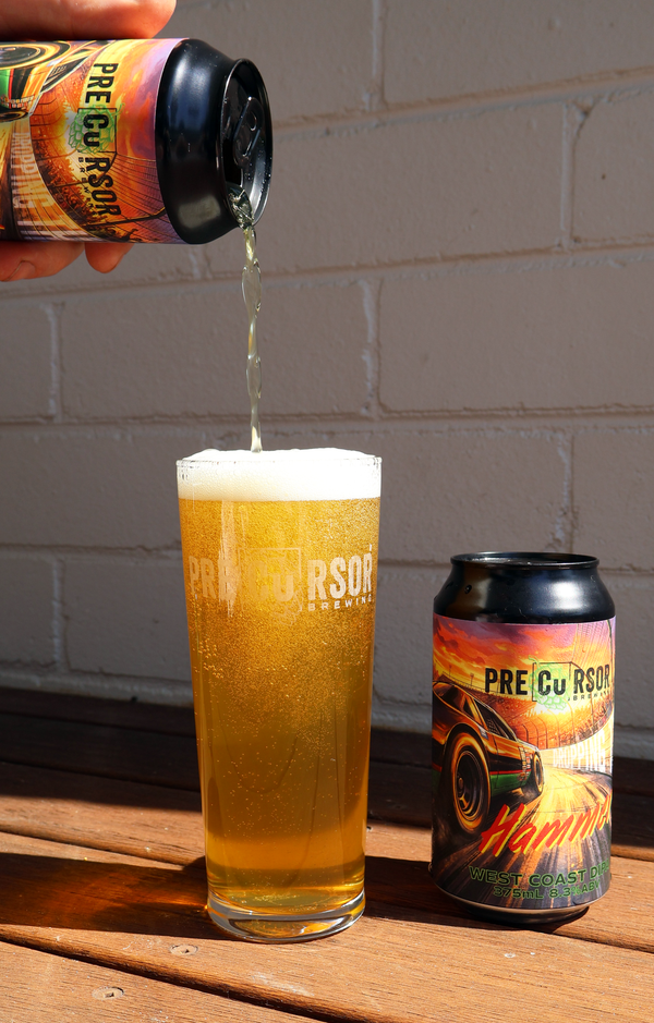 Precursor Brewing craft beer being poured from a can labeled 'Dropping The Hammer" into a glass